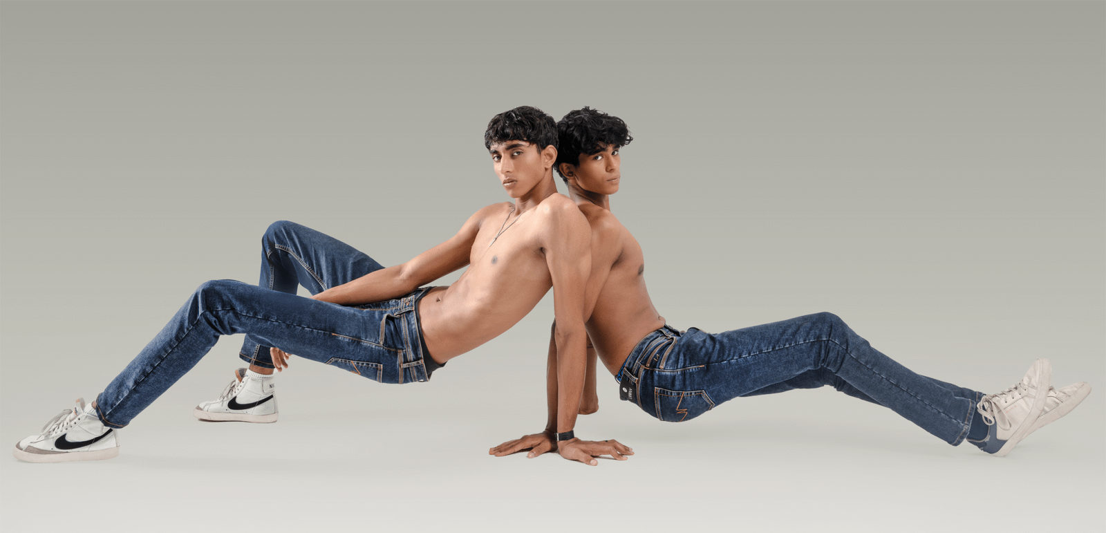 URWAN campaign — two models in blue denim
